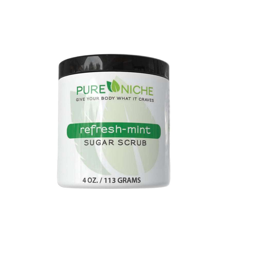 Jar of Pure Nicole refresh-mint sugar scrub on a gray background